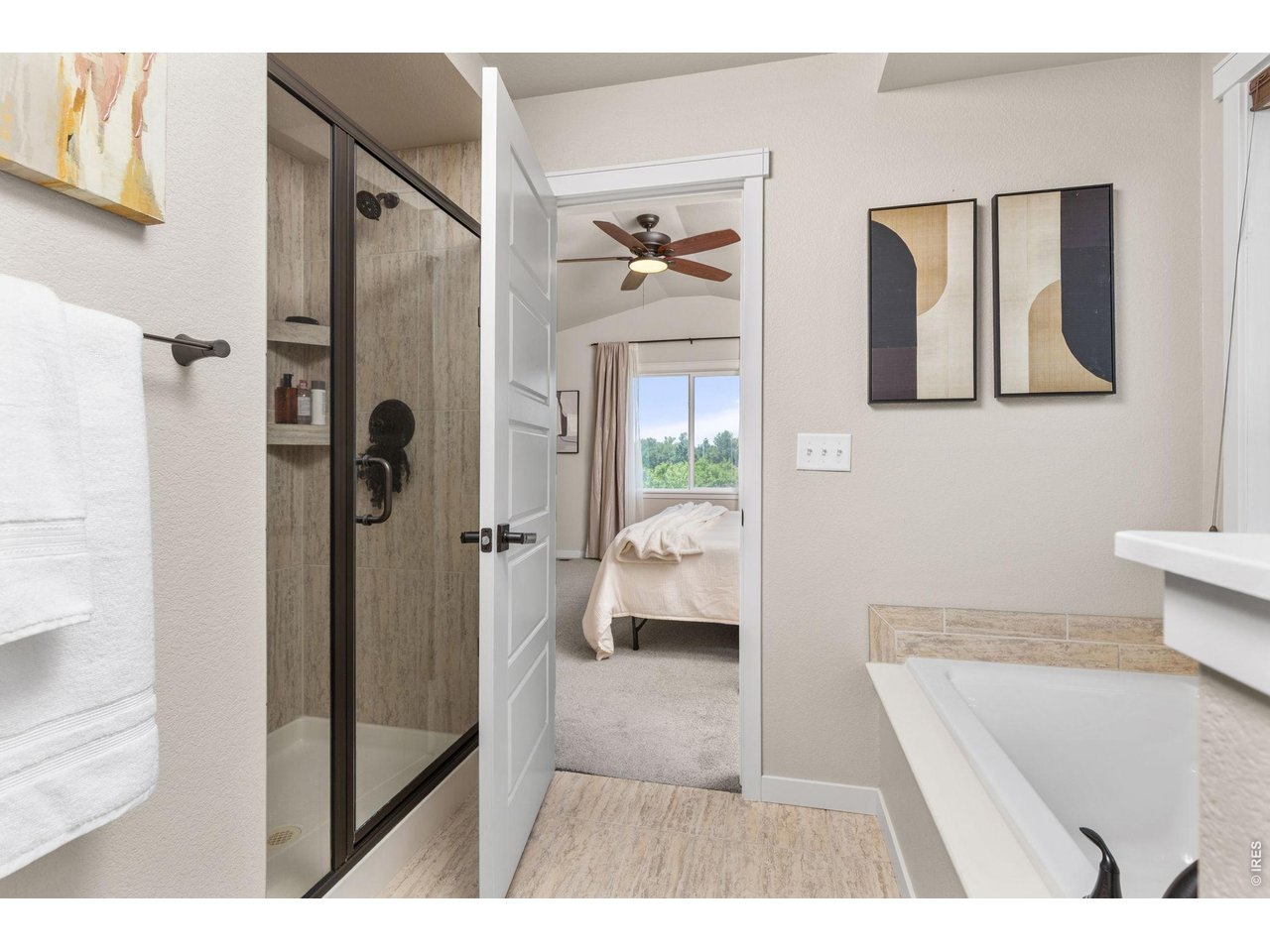 Property Photo 19 Primary bathroom with seperate shower and bath tub.