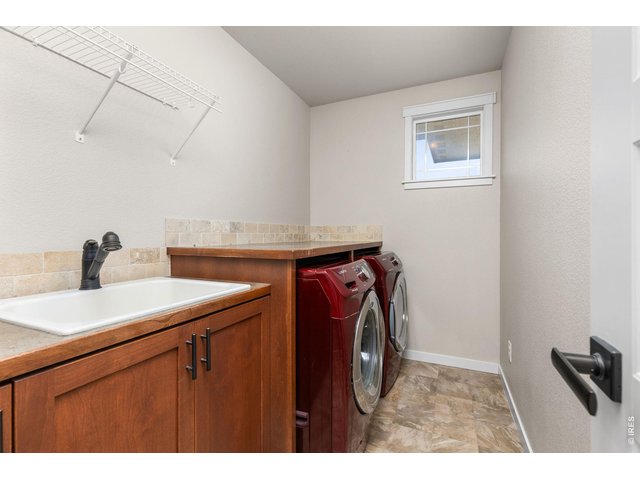 Property Photo 22 Upstairs laundry room with sink. Washer and dryer included.