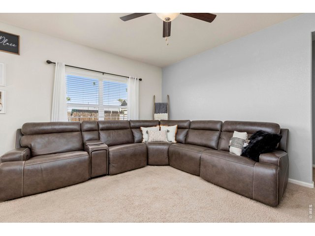 Property Photo 7 The open floor plan connects the spacious living room to the kitchen and dining area for easy everyday living and entertainment.