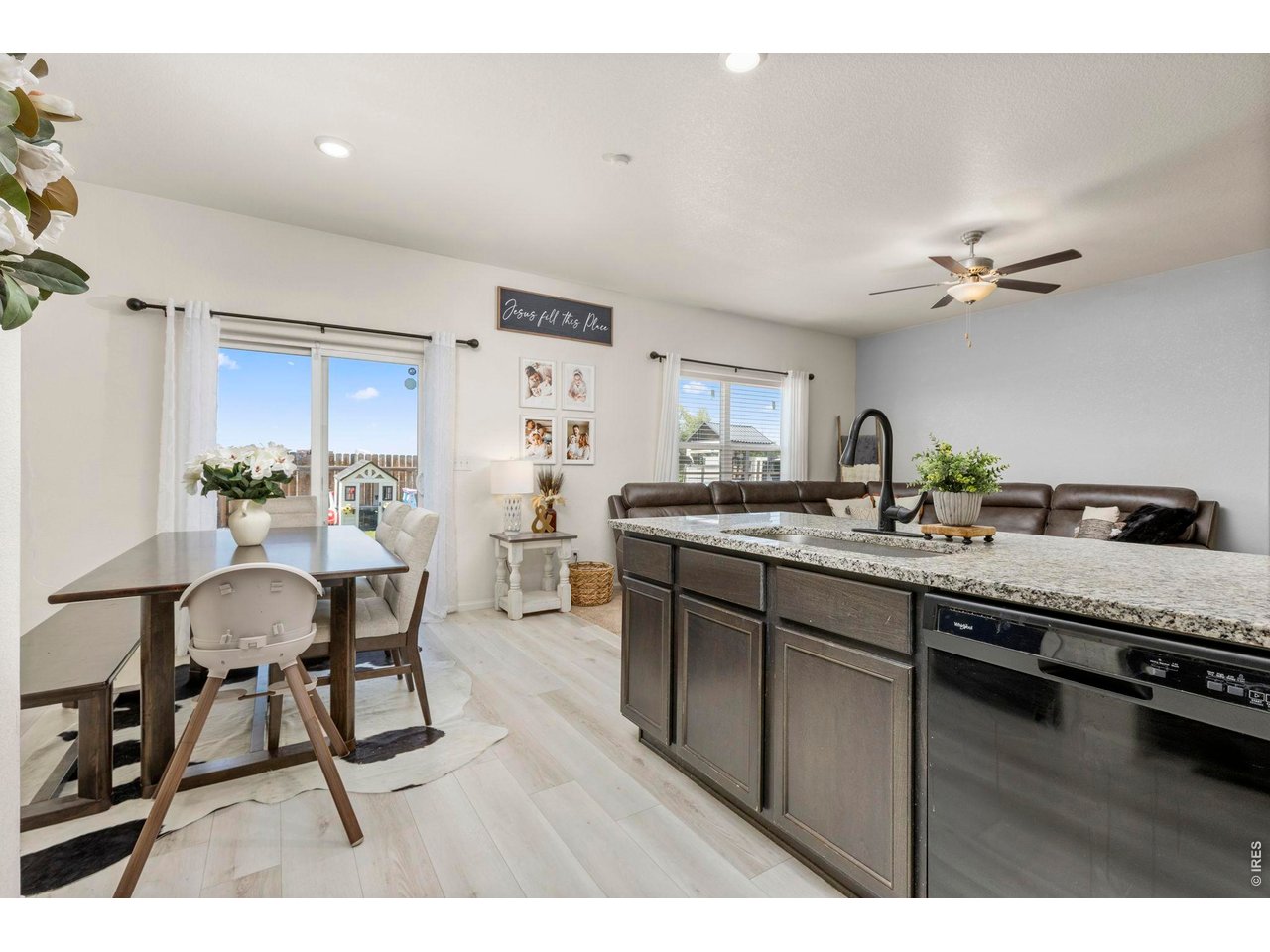 Property Photo 11 Durable laminate flooring runs throughout the main living spaces for style and easy maintenance.