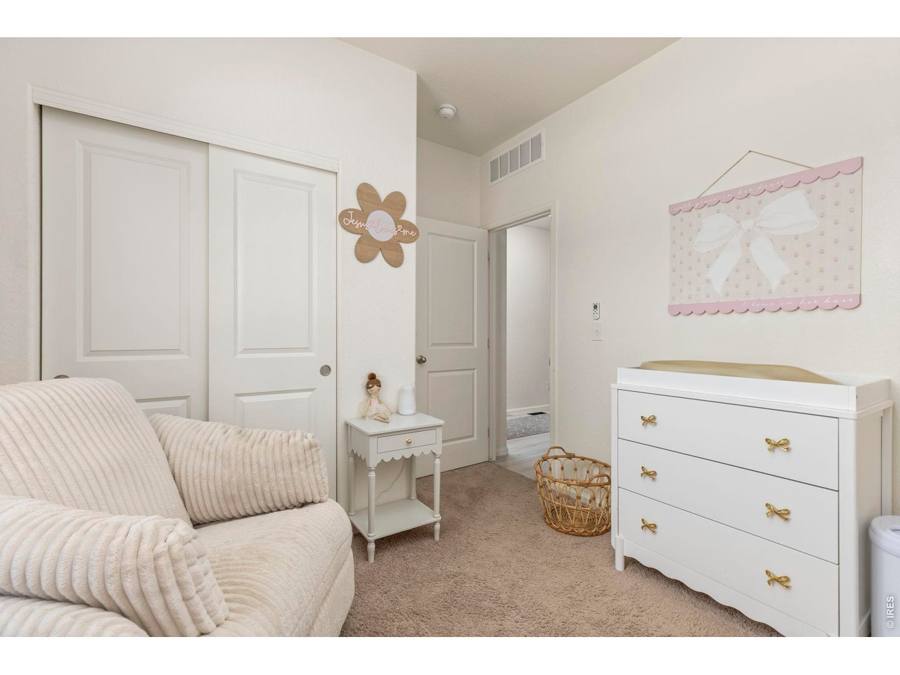 Property Photo 20 Two additional bedrooms offer flexibility for guests, a home office, or hobbies, including one with custom picture frame molding.