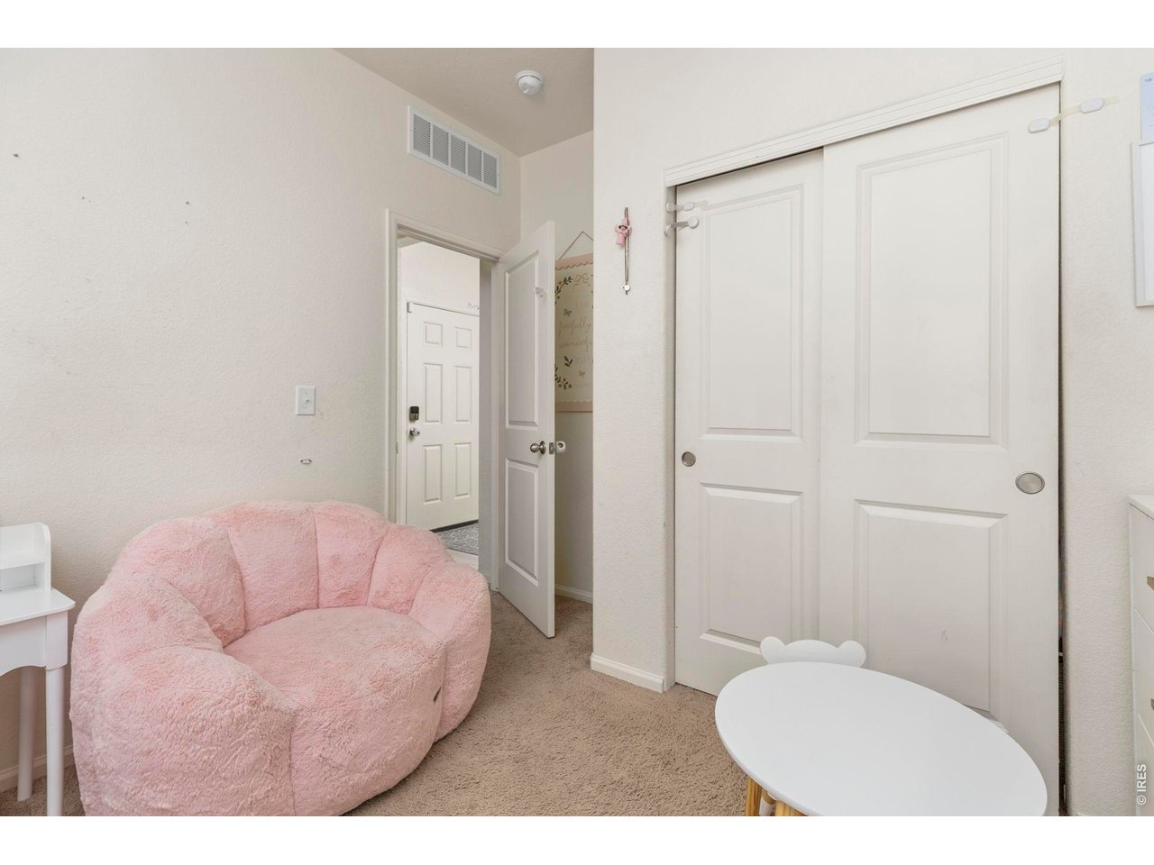 Property Photo 19 Two additional bedrooms offer flexibility for guests, a home office, or hobbies, including one with custom picture frame molding.