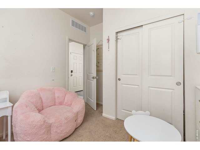 Property Photo 19 Two additional bedrooms offer flexibility for guests, a home office, or hobbies, including one with custom picture frame molding.