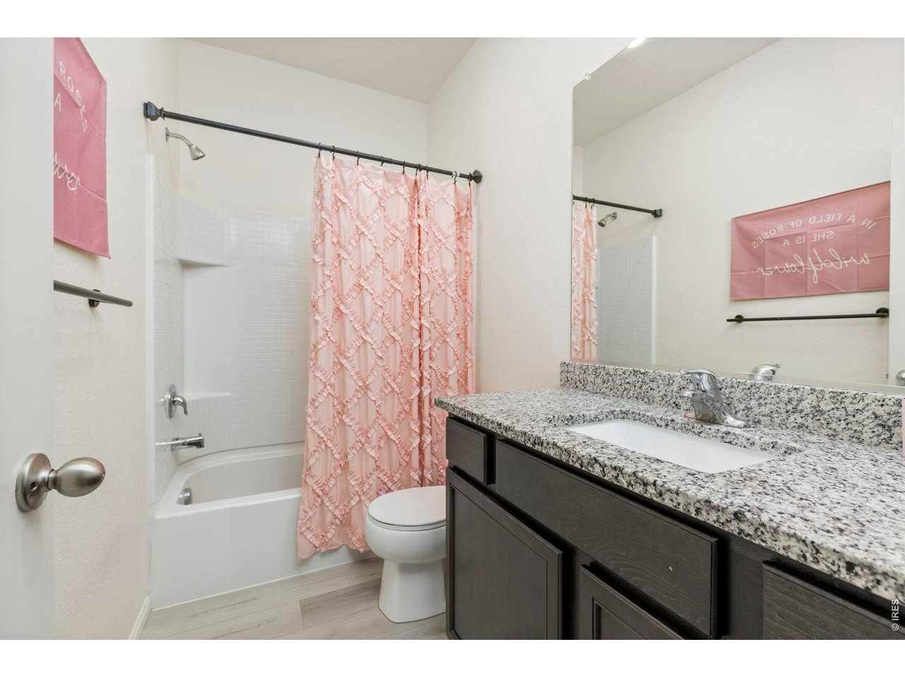 Property Photo 21 he secondary full bathroom also features granite countertops.