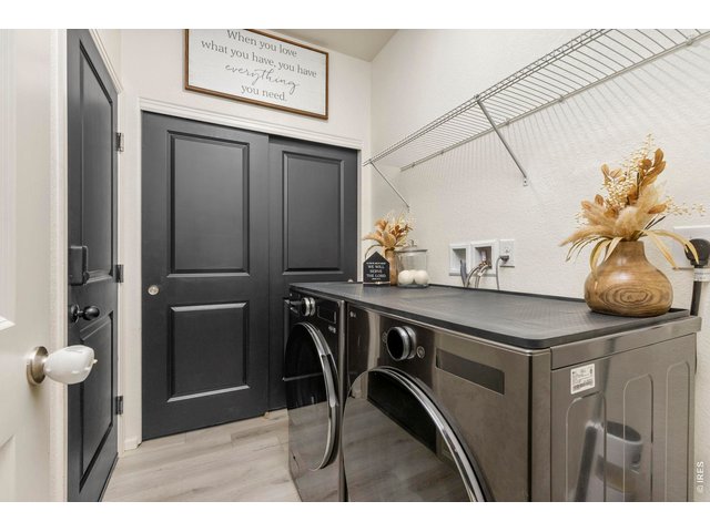 Property Photo 22 The laundry room provides additional storage and convenient access to the attached two-car garage.
