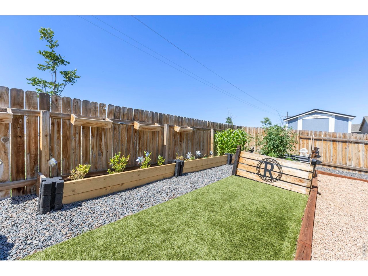 Property Photo 25 The south-facing orientation helps promote faster snow melt during winter months. Additional highlights include a new roof (2026) with a transferable warranty, central A/C, fresh interior paint, newly finished baseboards, and an easy commute to Denver, Bri