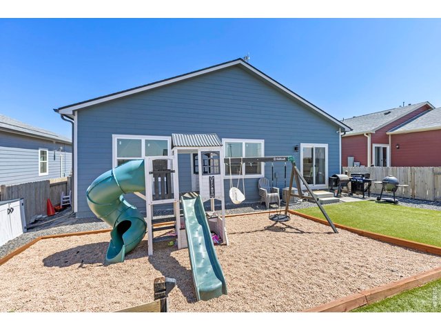 Property Photo 26 The south-facing orientation helps promote faster snow melt during winter months. Additional highlights include a new roof (2026) with a transferable warranty, central A/C, fresh interior paint, newly finished baseboards, and an easy commute to Denver, Bri