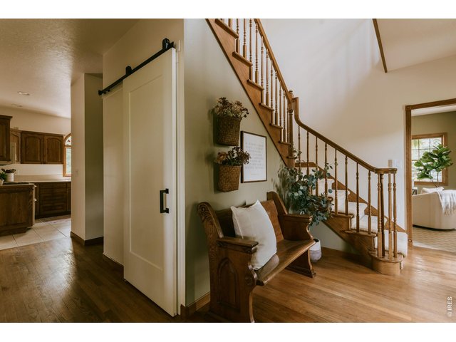 Property Photo 33 Wood floors and custom walk in pantry w/ barn door