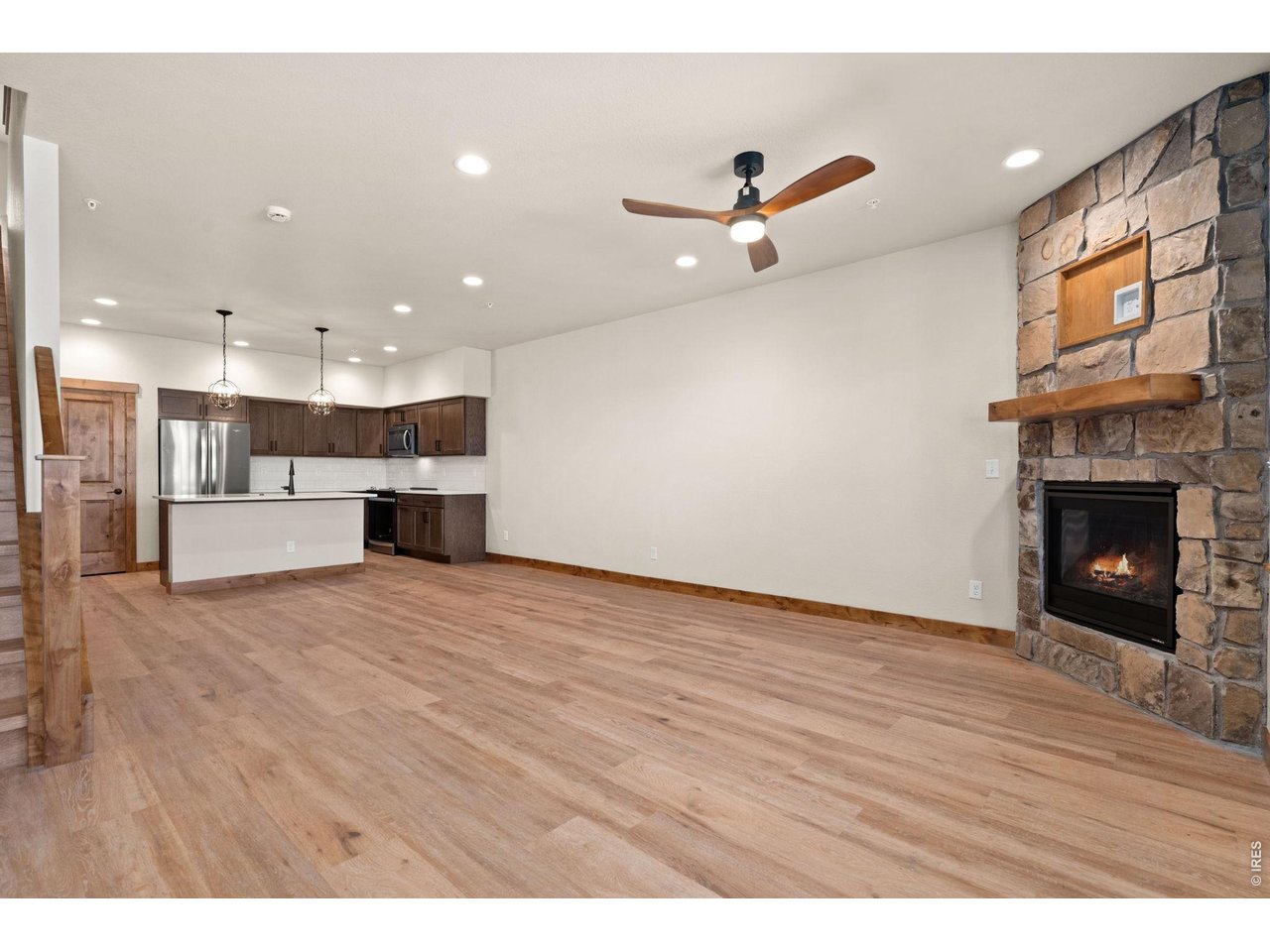 Property Photo 2 Floor to ceiling stone gas fireplace.