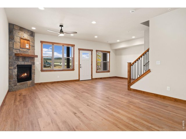 Property Photo 3 Big picture windows and gas fireplace