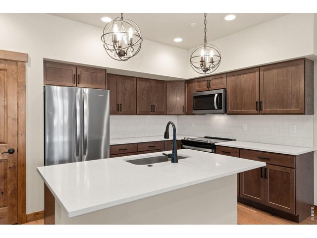 Property Photo 6 Large island with quartz counter tops.