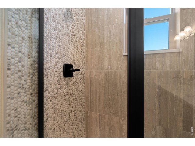 Property Photo 15 Beautiful tiled shower with glass doors