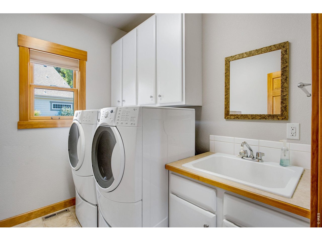 Property Photo 30 Comes with the washer and dryer too - spacious laundry room and convenient utility sink!