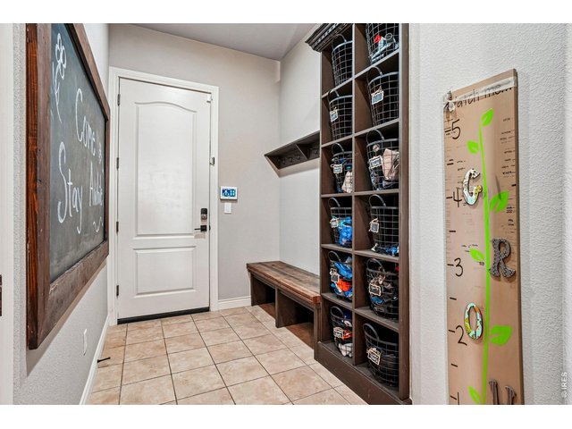 Property Photo 20 Large organized drop zone off the garage area with magnetic chalk board - perfect for notes, reminders and well wishes
