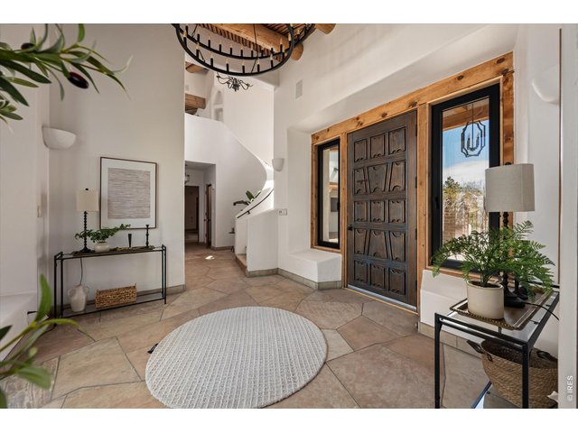 Property Photo 4 Inside, rich textures and artisan details define the experience.