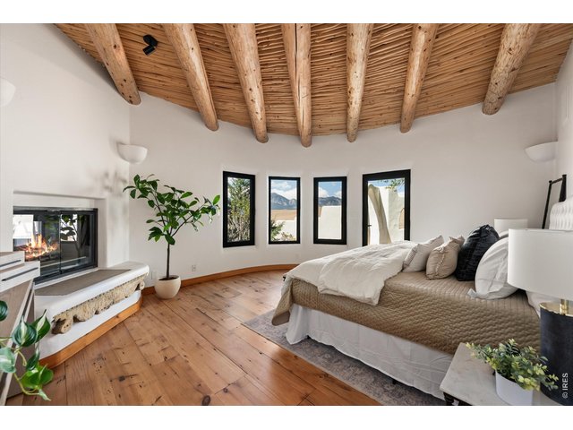 Property Photo 27 17 x 14 Primary Suite with access to private courtyard and see through fireplace.