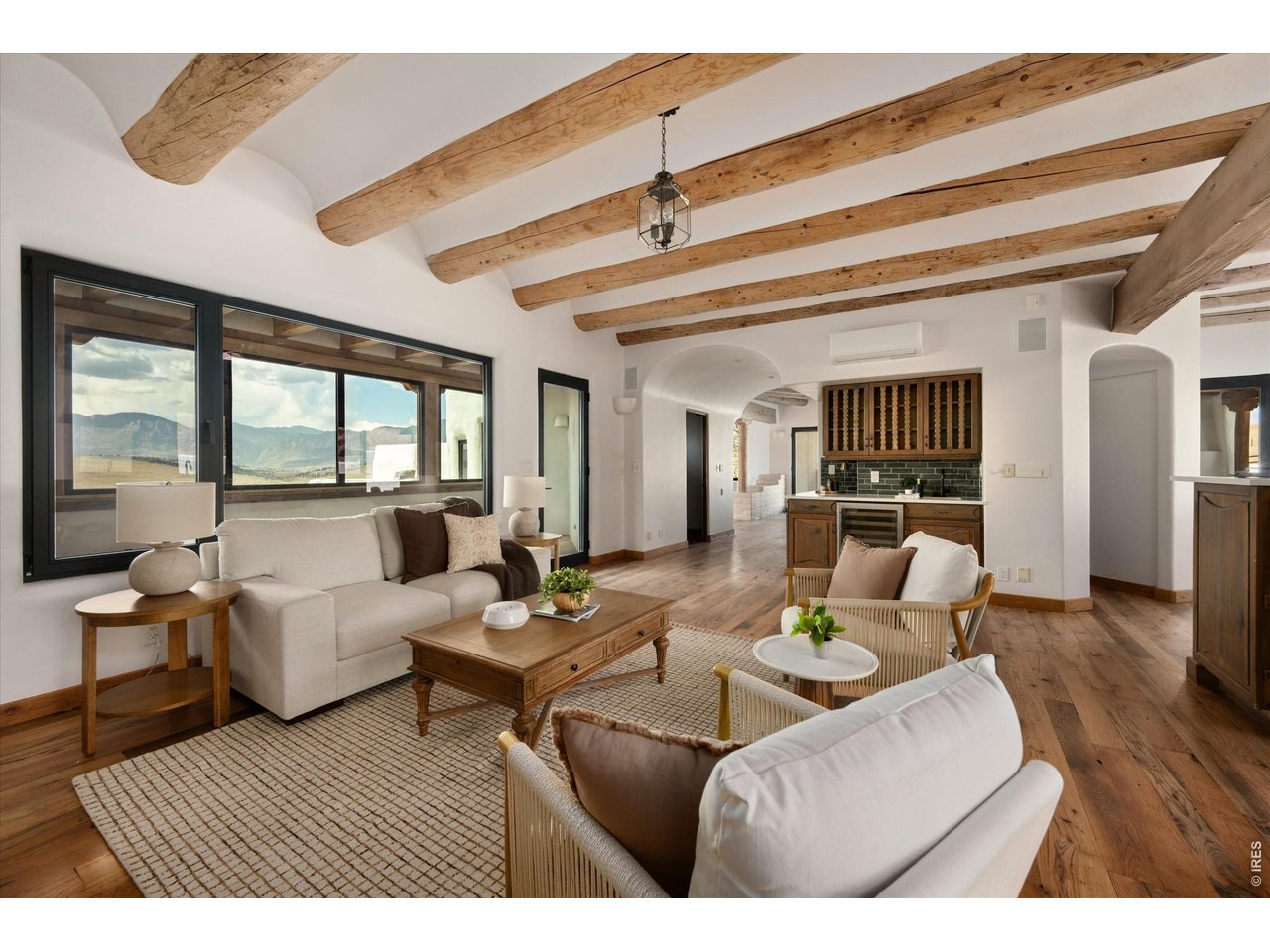 Property Photo 14 The upper main level is designed for both gathering and retreat, featuring a beautifully appointed kitchen that flows seamlessly into dining and living spaces.