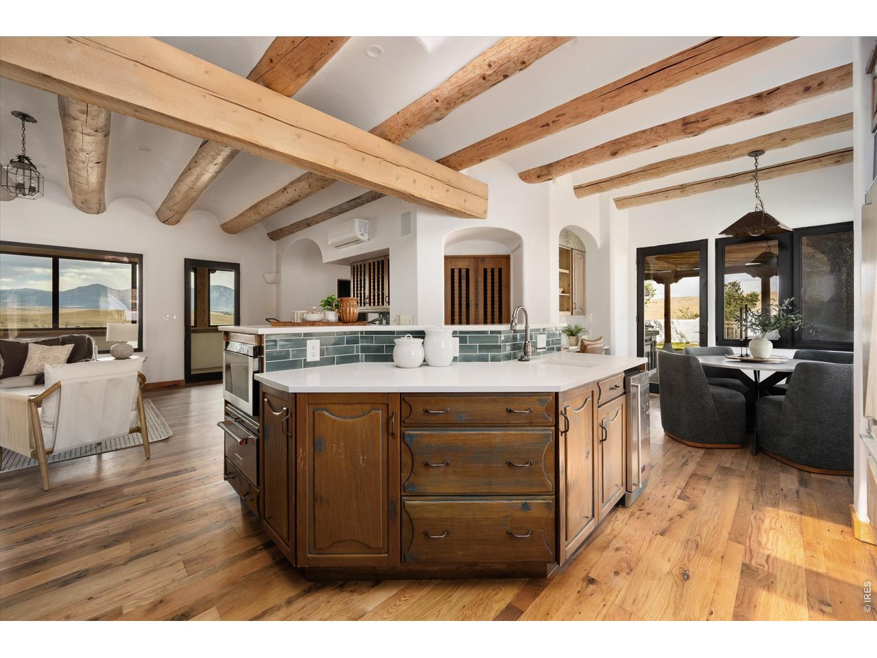Property Photo 15 The upper main level features a beautifully updated kitchen, quartz countertops, and new backsplash.
