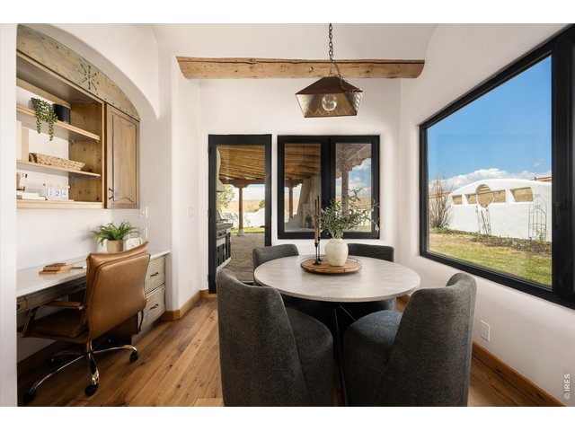 Property Photo 19 A charming breakfast nook just off the kitchen with direct outdoor access, perfect for effortless indoor-outdoor dining and morning coffee. 13 x 10