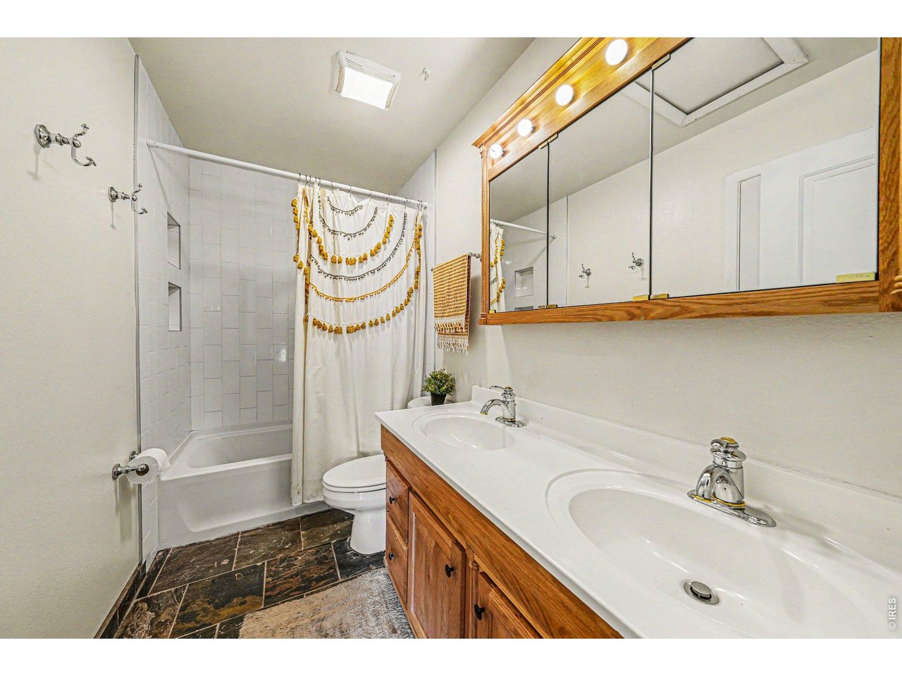 Property Photo 9 Main full bathroom with new tub and tile surround