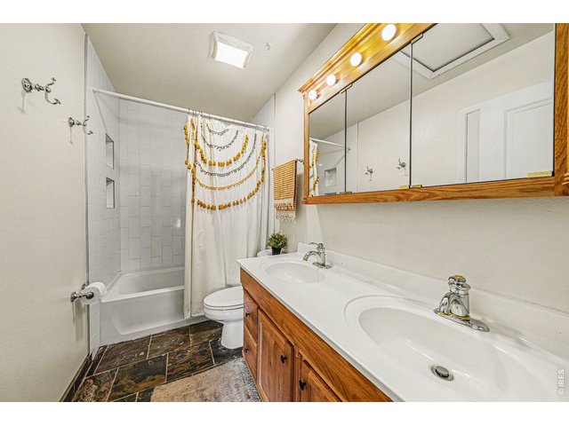 Property Photo 9 Main full bathroom with new tub and tile surround