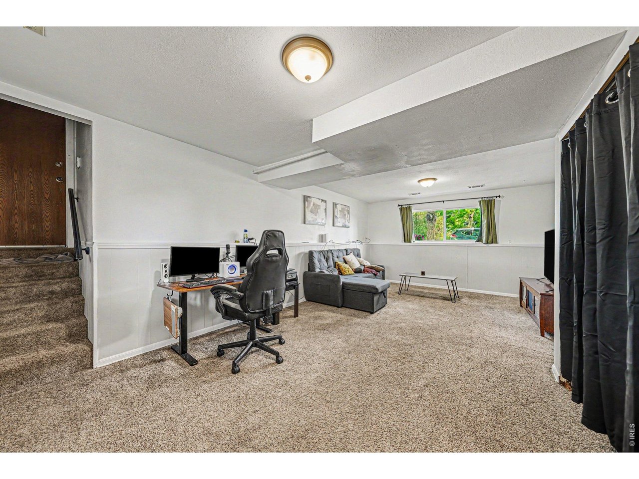 Property Photo 12 Lower level living space perfect for another lounge space, office, or playroom