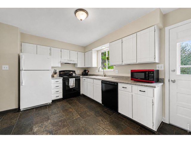 Property Photo 7 Kitchen with tile flooring