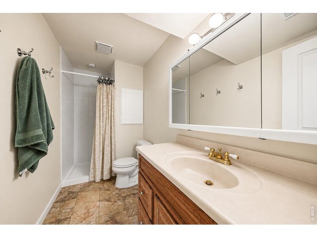 Property Photo 14 Lower level 3/4 bath with new tile and pan