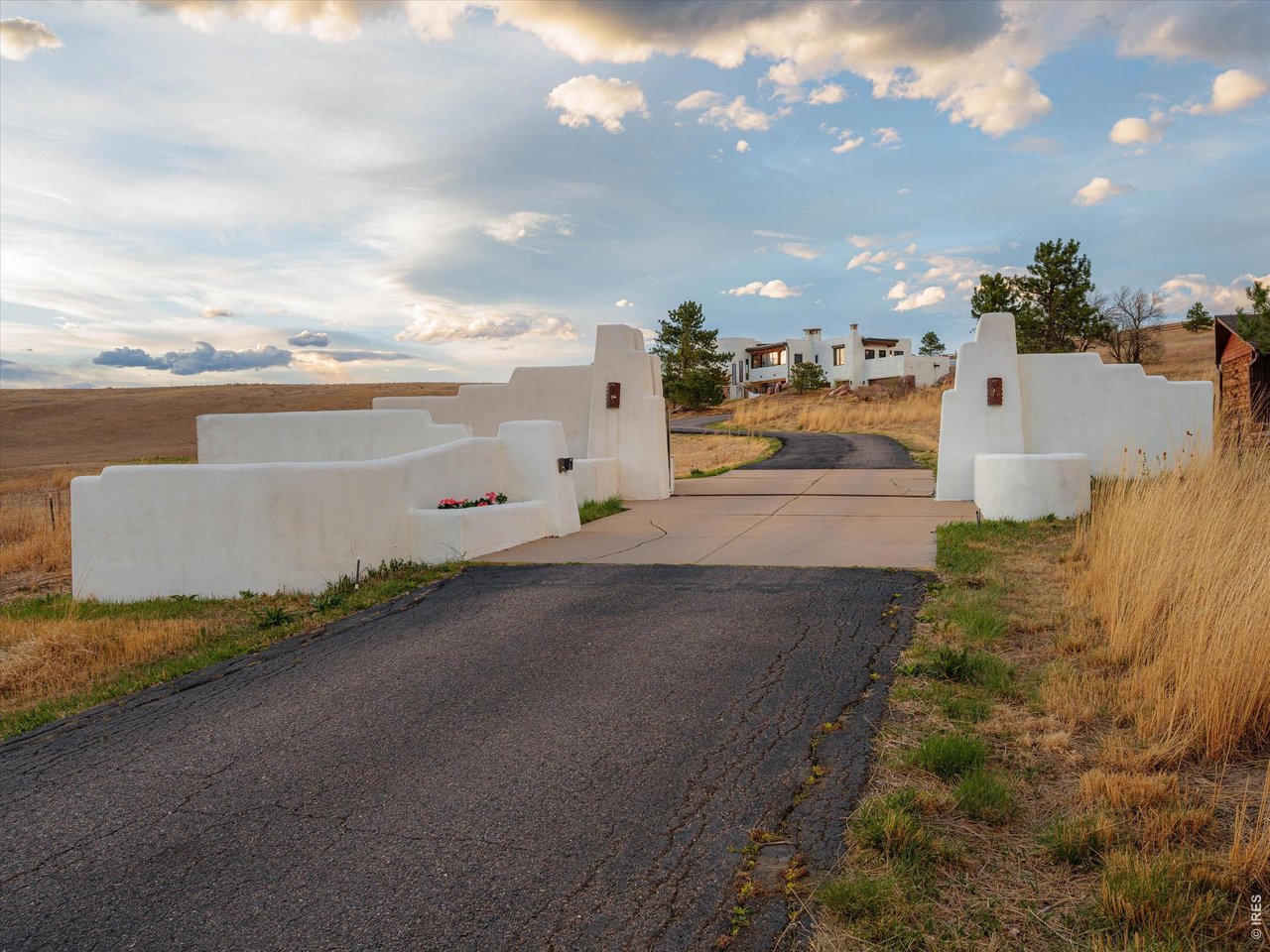 Property Photo 2 Behind a private gated entrance, the residence unfolds across approximately 5,800 square feet.