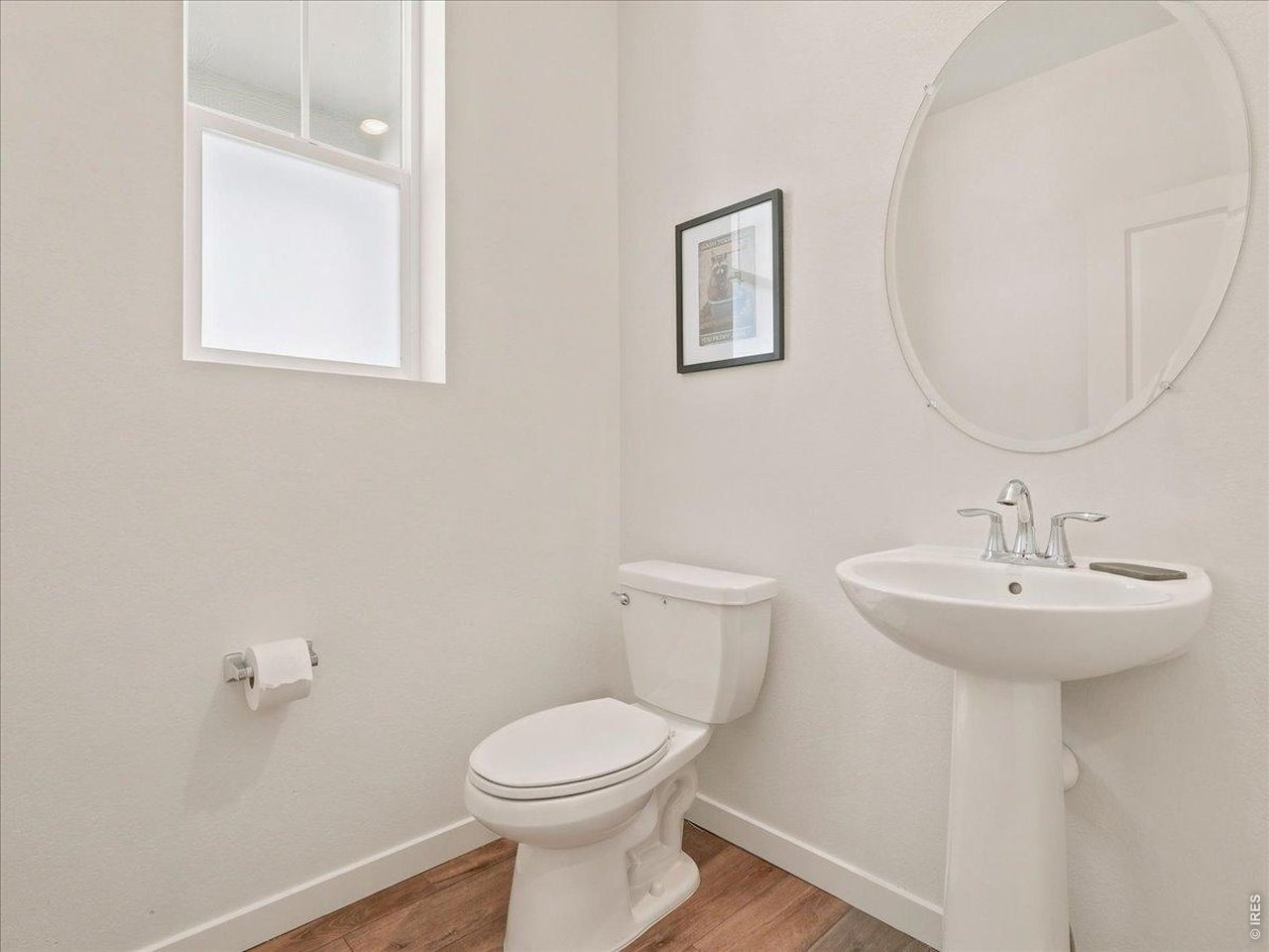 Property Photo 18 Downstairs half bath - Convenient for family or guests.