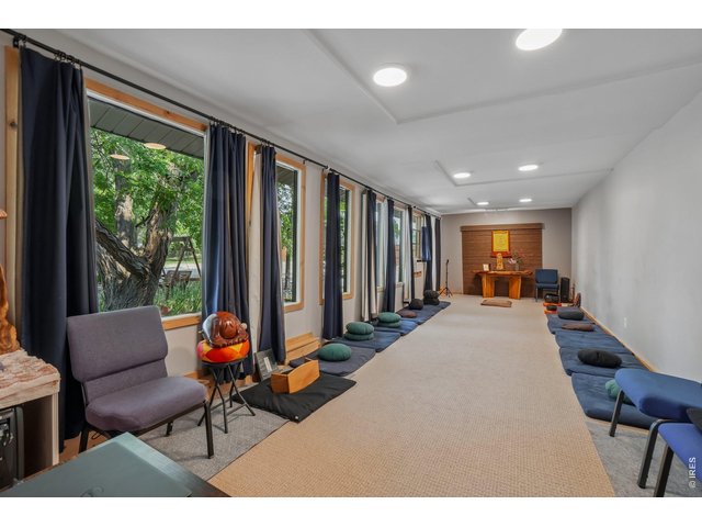 Property Photo 19 North side of the house is currently used as a Zen center - these rooms offer great flex space for home based businesses or multi generational living.