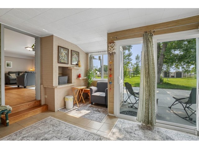 Property Photo 36 Main floor room with 2 steps down with outdoor patio for peaceful morning coffee or tea while watching the sunrise