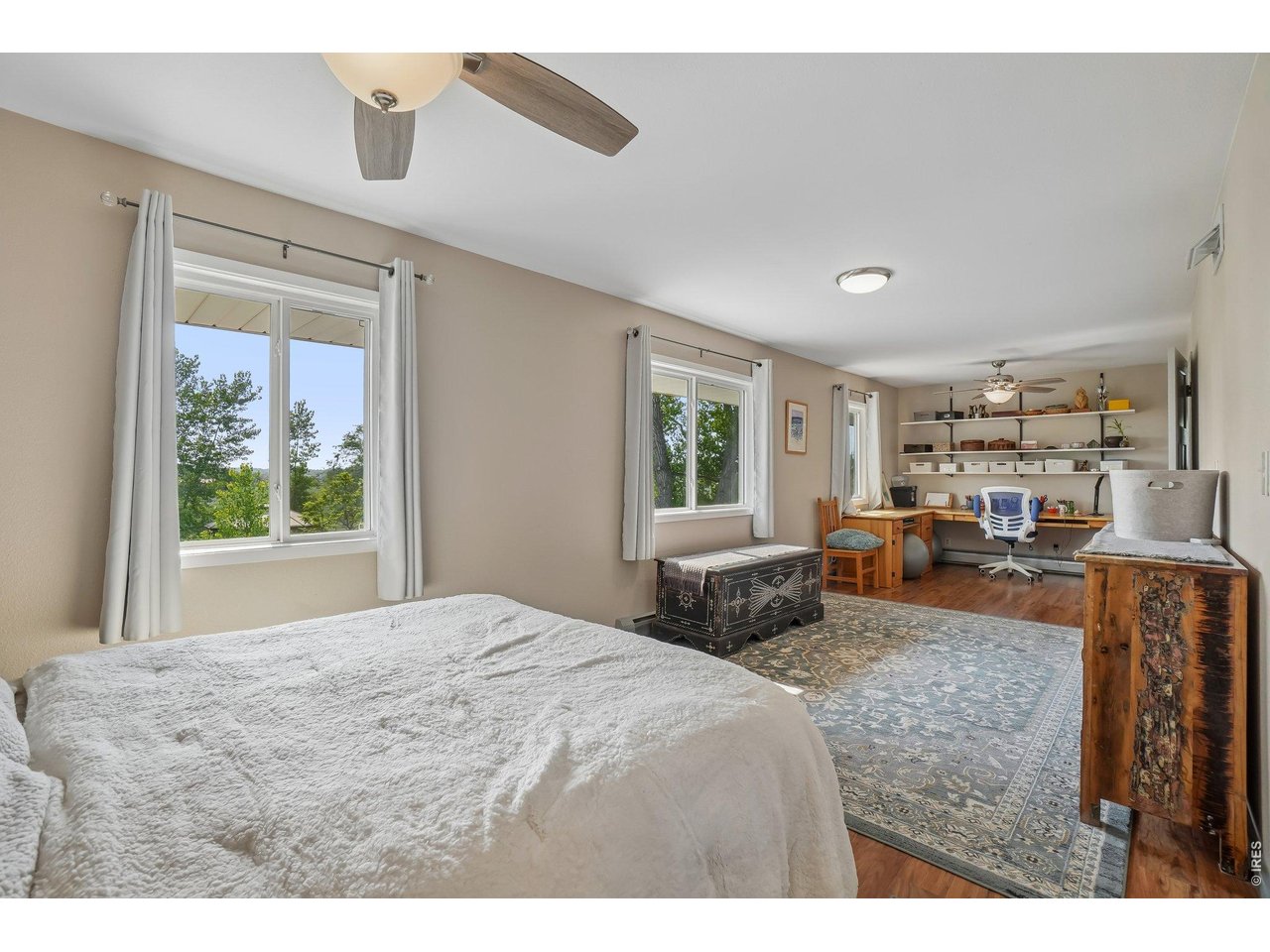 Property Photo 41 Large upstairs bedroom on the second floor with east facing windows in main house