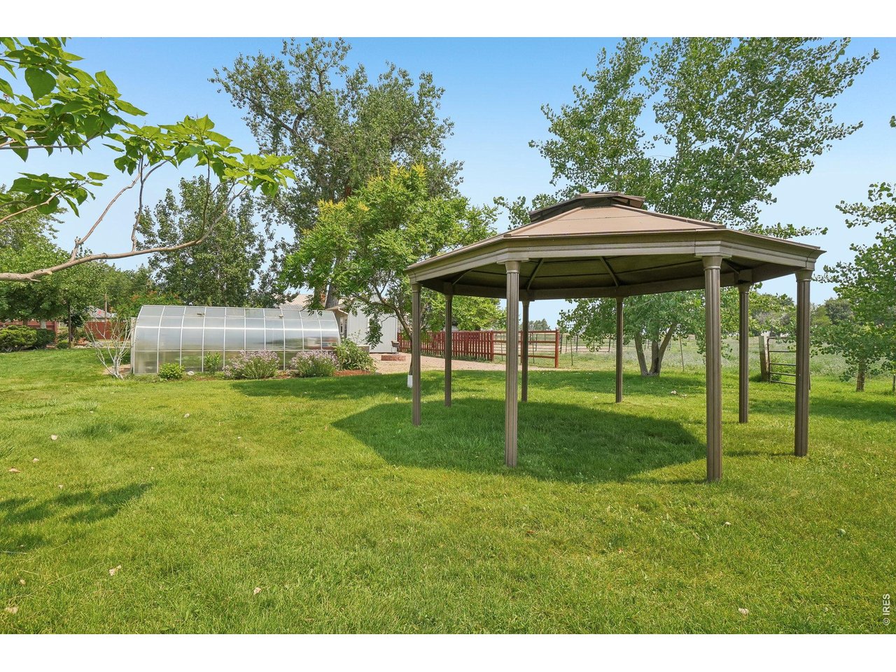 Property Photo 13 Backyard gazebo provides valuable shade while enjoying the beautiful grounds