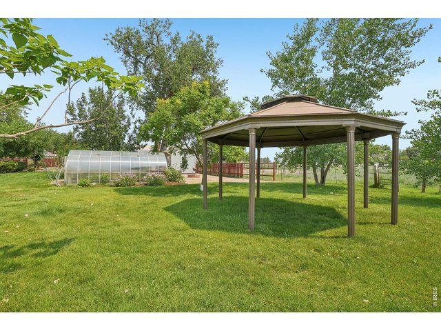 Property Photo 13 Backyard gazebo provides valuable shade while enjoying the beautiful grounds