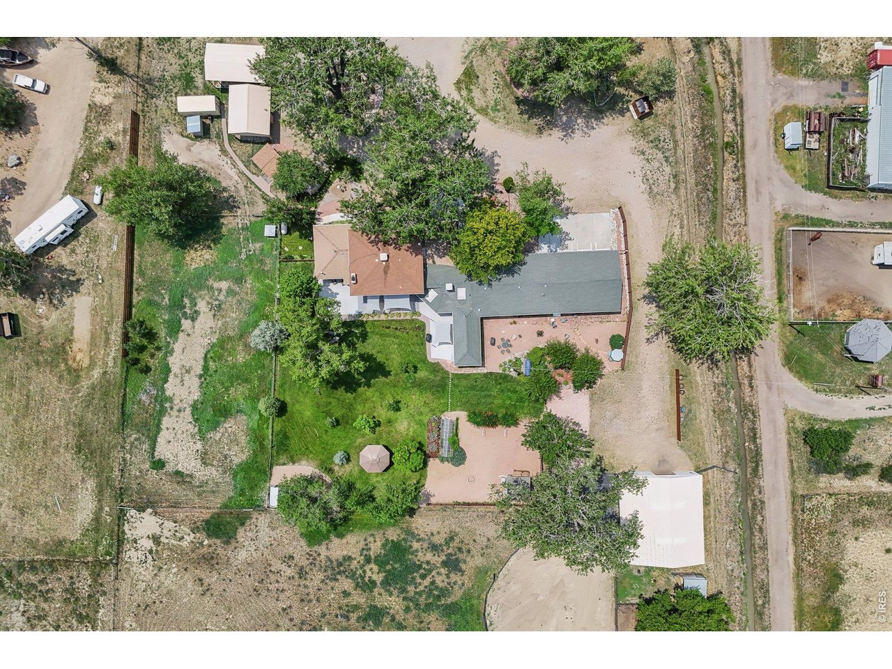 Property Photo 6 Ariel view of the property - left side is the main house, right side is the secondary attached area