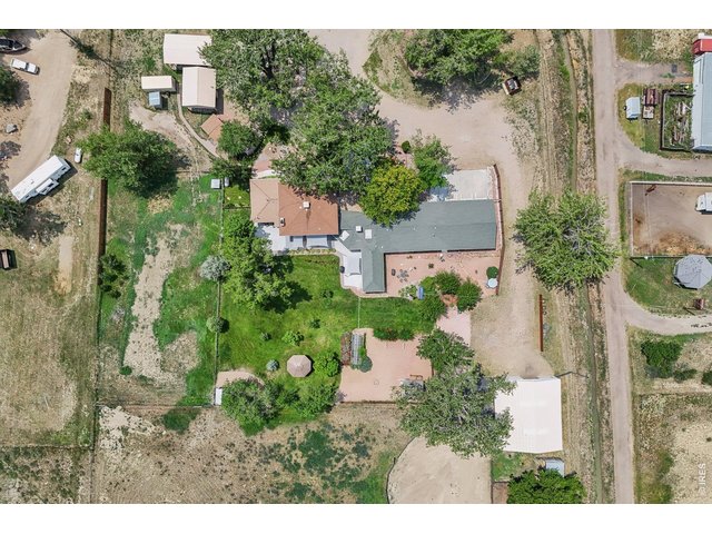 Property Photo 6 Ariel view of the property - left side is the main house, right side is the secondary attached area