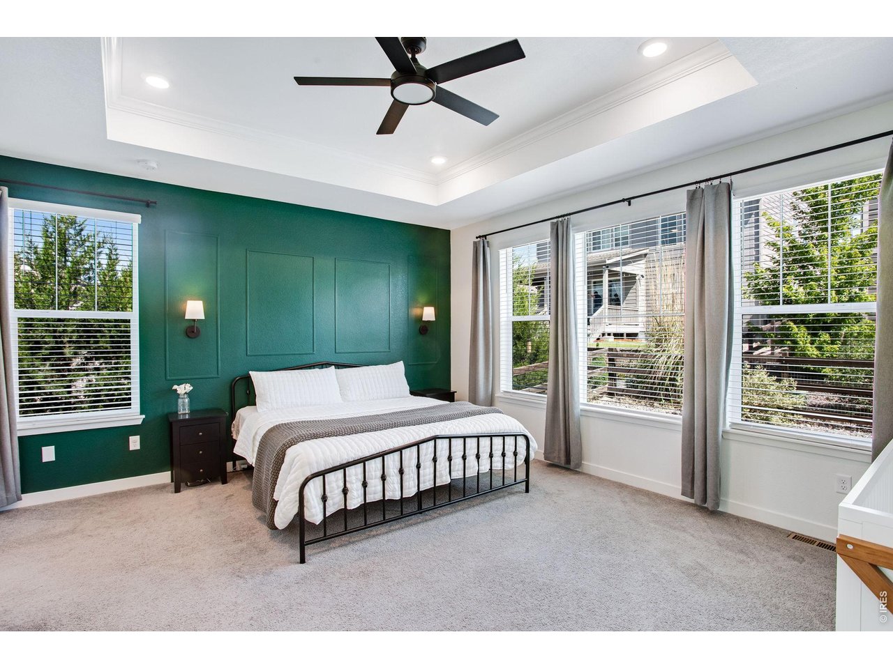 Property Photo 18 oversized primary bedroom with custom accent wall and tons of natural light