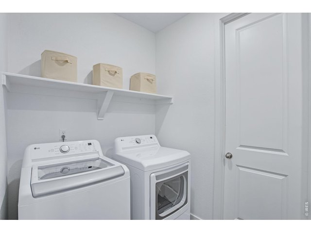 Property Photo 22 large laundry room with tons of storage!