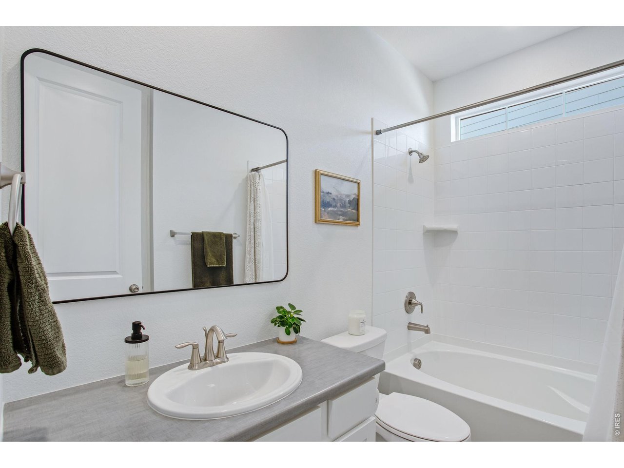 Property Photo 31 bathroom adjacent to rooms 2&3, upgraded mirror and window, full tub