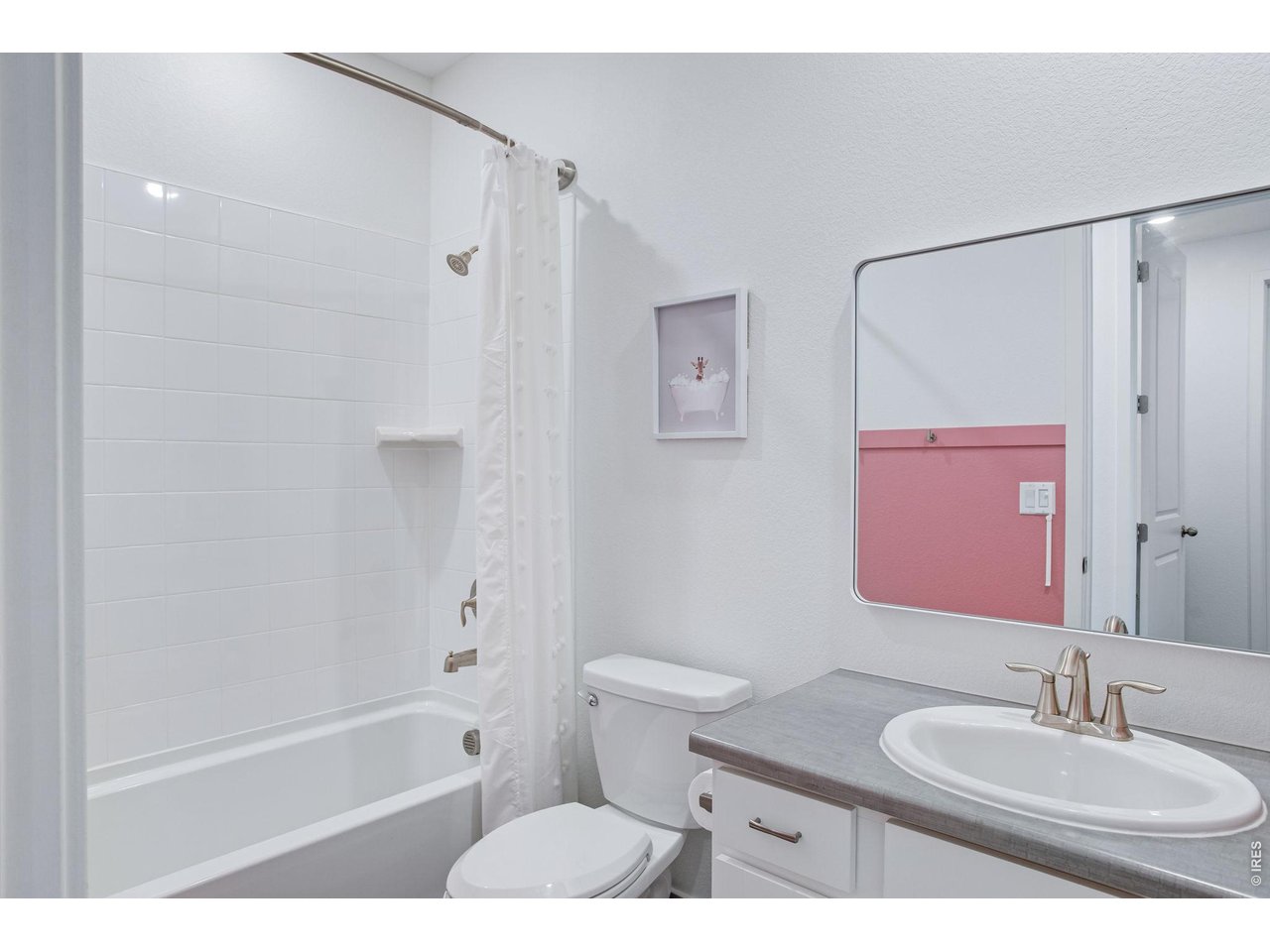 Property Photo 28 Bathroom adjacent to bedroom 2, custom accent wall to decorate around! Full tub