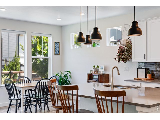Property Photo 4 eat-in kitchen full of natural light and more than enough space for the whole fam