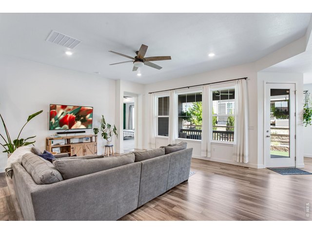 Property Photo 15 oversized picture windows, upgraded can lighting and ceiling fan