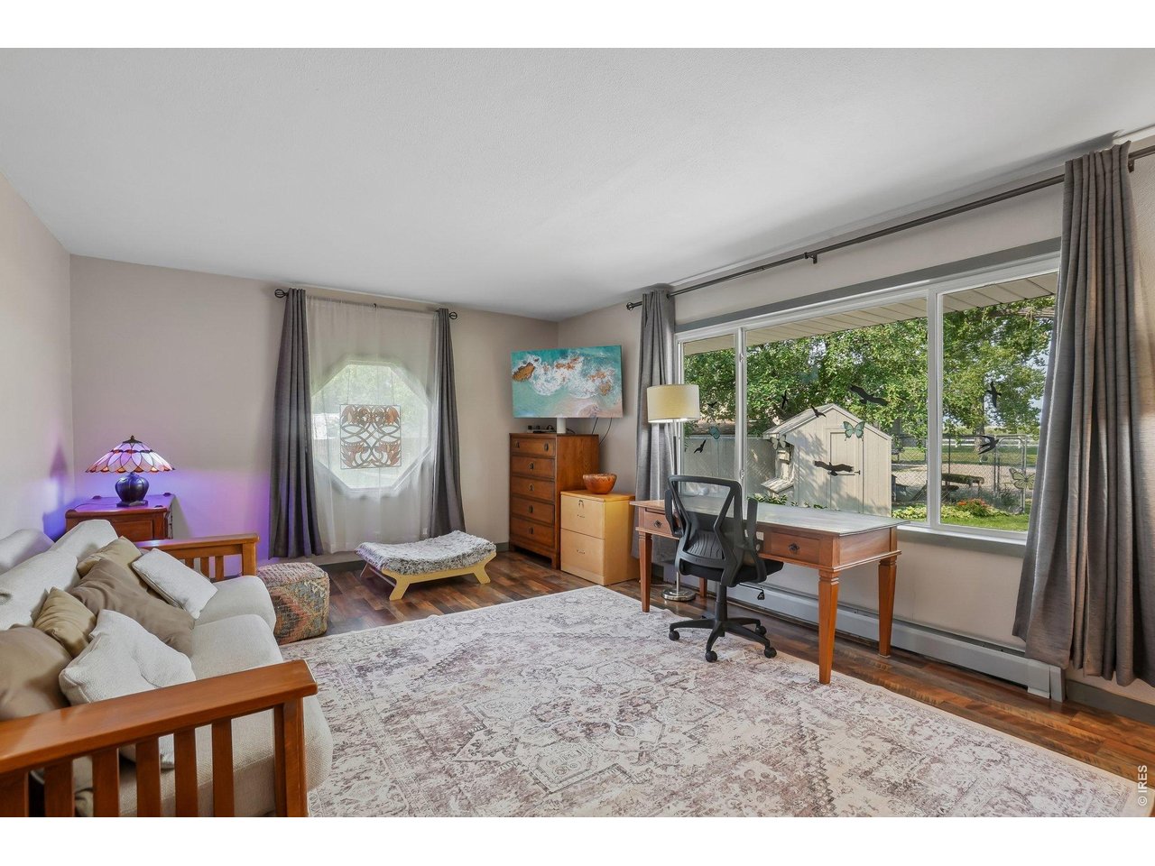 Property Photo 32 Off the entry way is this beautiful multi use space with wonderful natural light facing west with mountain views