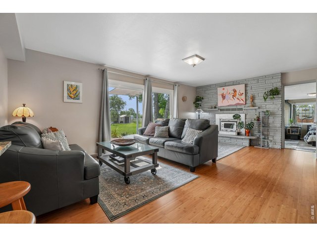 Property Photo 33 Family room off the kitchen area with fireplace and sliding doors to large east facing patio