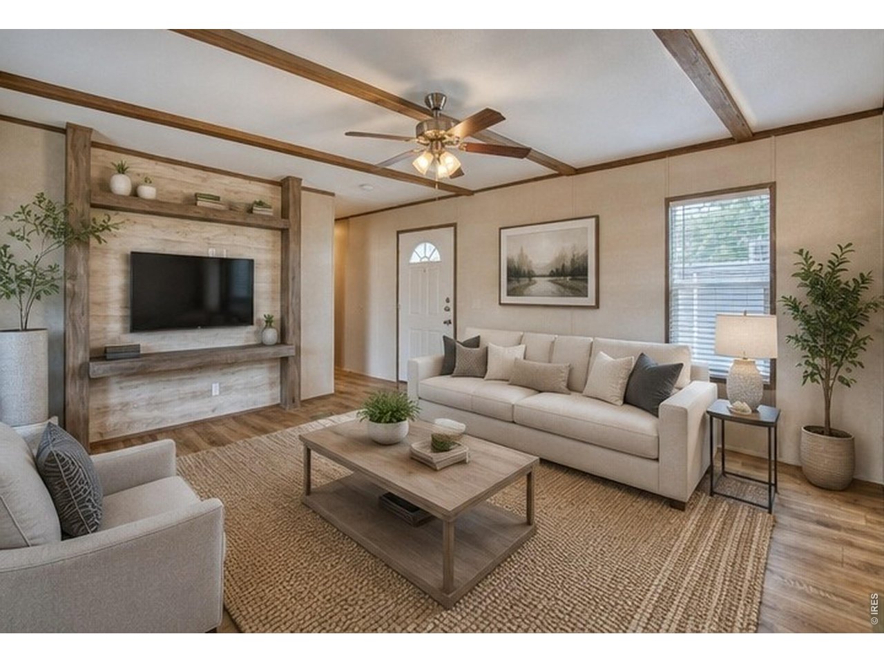 Property Photo 3 Perfect for relaxing or entertaining, this inviting space offers the ideal setting for both quiet evenings at home and hosting guests.