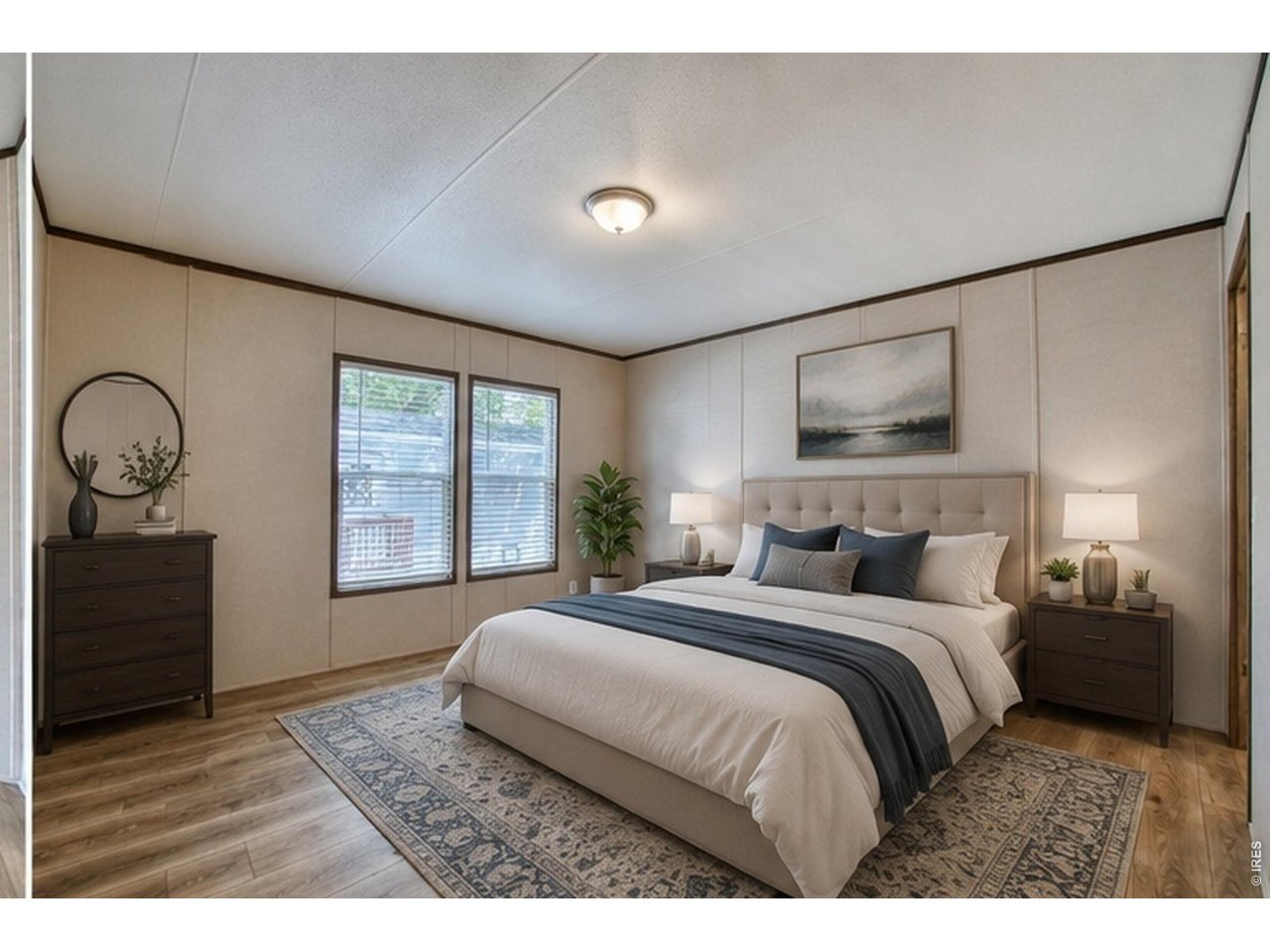 Property Photo 10 This luxurious primary suite offers a serene retreat with high-end finishes and ample space for relaxation.