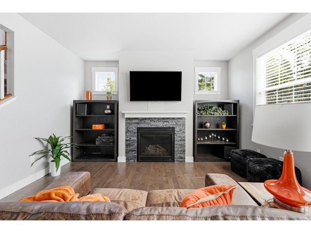 Property Photo 7 Inviting family room with a cozy gas fireplace