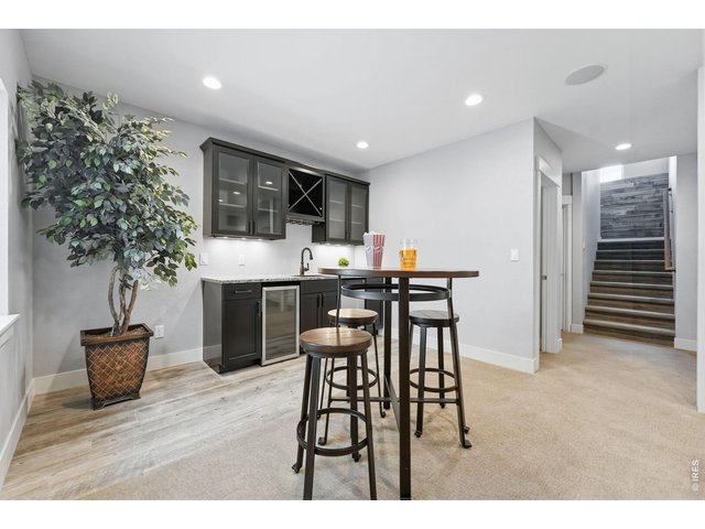 Property Photo 30 Large recreation room in basement complete with a wet bar, dishwasher, mini refrigerator