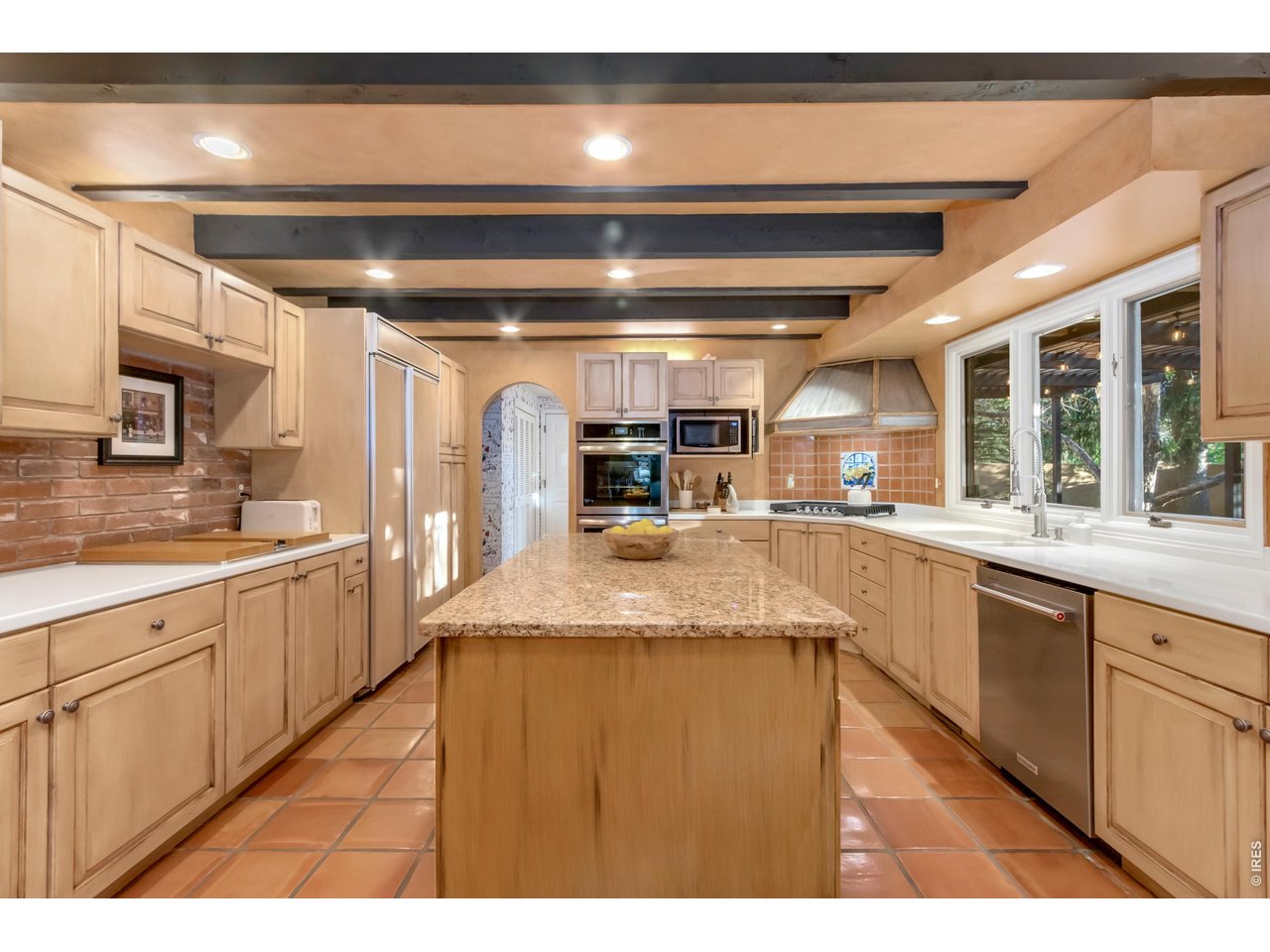Property Photo 20 Large center island offers abundant prep and gathering space.